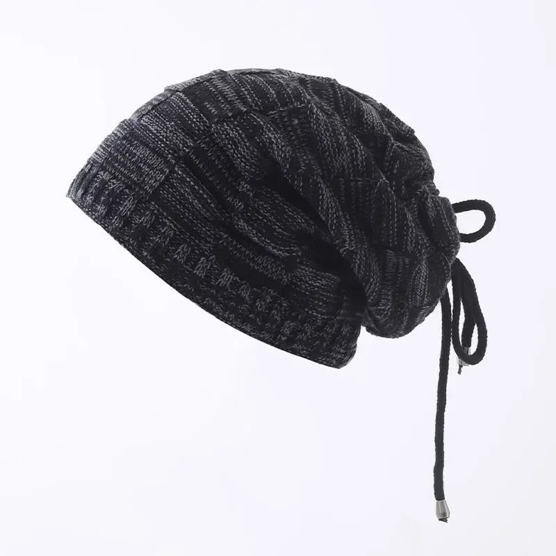 Dark gray knit beanie with drawstring on a white background
