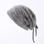 Gray knit beanie with drawstring on a white background