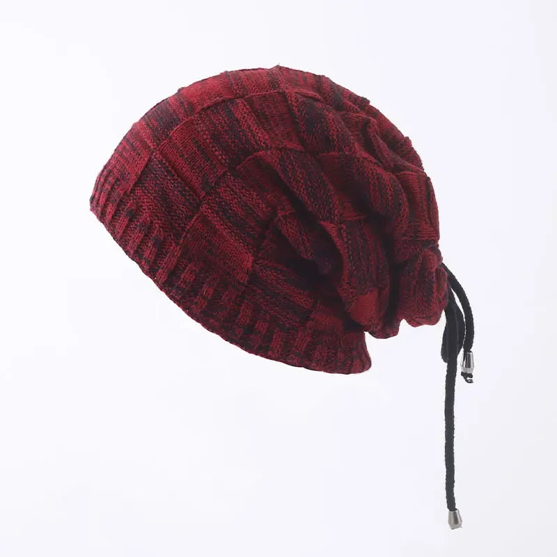 Red knitted beanie with a drawstring on a white background