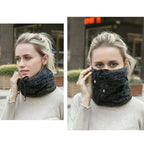 Woman wearing a dark gray scarf in two different ways outdoors.