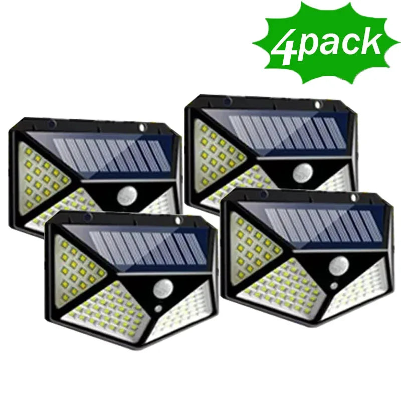 Four solar-powered LED motion sensor lights with a '4 pack' label on a white background.