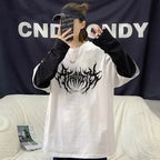 atrocity print loose fit baggy tshirt with a gothic goth design