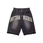 Black denim shorts with 'Bottega Desires' text on a white background