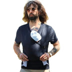Man wearing a black leather vest over a graphic t-shirt with a white design.