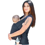 Woman holding a baby in a carrier against a white background