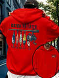A person wearing a bright red hoodie outdoors, shown from the back with a large fishing-themed graphic reading "CATCH YA LATER" across the back. The design includes illustrated fishing lures and a fishing rod.