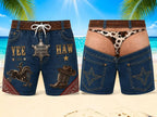 Two pairs of denim cowboy-style shorts shown on a beach background. The left pair has western graphics including 'YEE HAW', a sheriff's badge, a cowboy boot, and a horse motif.