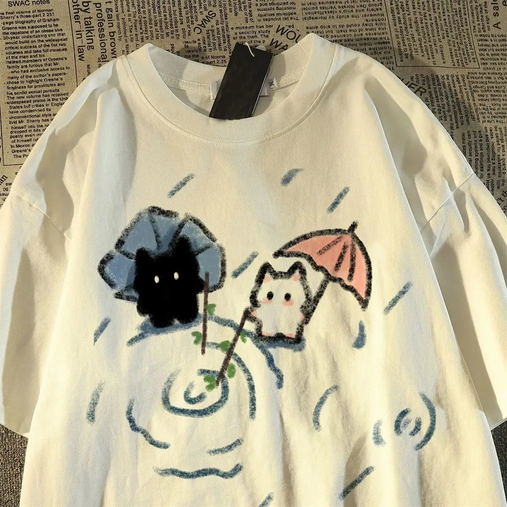 White T-shirt with cartoon cat cats design.