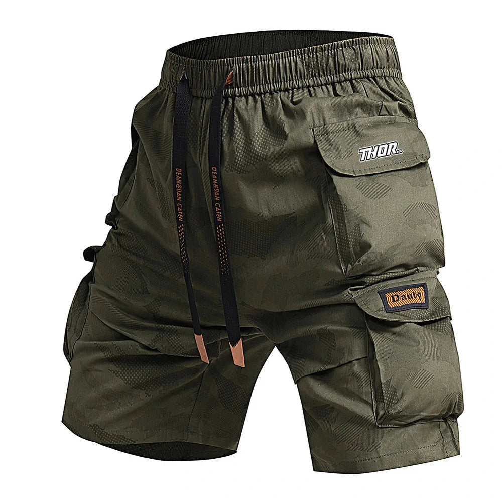Green cargo shorts with multiple pockets and brand logos on a white background