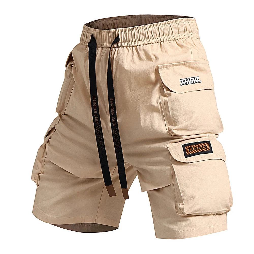 Beige cargo shorts with multiple pockets and a visible brand logo on a white background