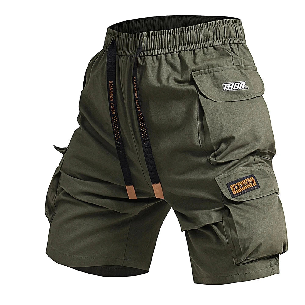 Green cargo shorts with multiple pockets and 'Thor' branding on a white background