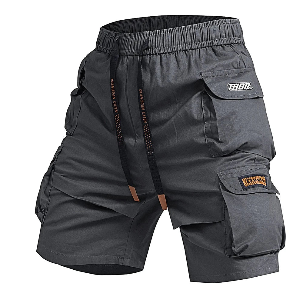 Gray cargo shorts with multiple pockets and 'Thor' branding on a white background