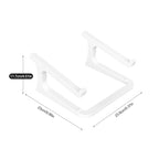 White plastic monitor stand shown with dimension labels and arrows indicating 11.7 cm height, 23 cm width, and 23.