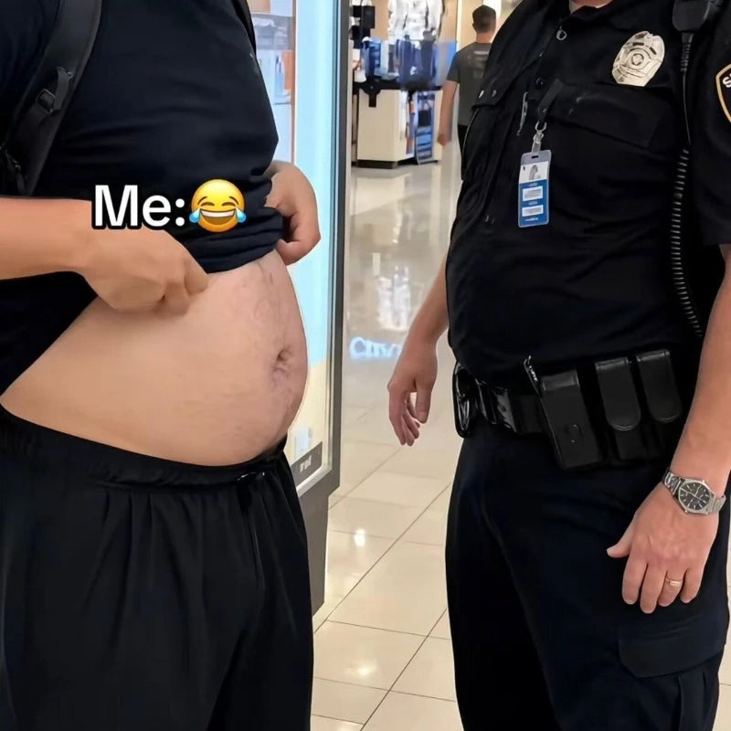 A person in a black shirt and shorts lifts their shirt to show a large stomach, standing next to a police officer in a store.