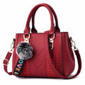 French-Style Tote Handbag With Shoulder Strap and Signature Pom-Pom
