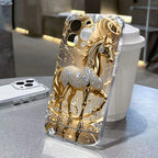 Gold and silver horse design phone case on a table with a blurred background