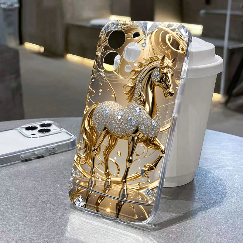 Gold and silver horse design phone case on a table with a blurred background