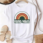 Vintage white short-sleeve T-shirt with a retro rainbow graphic and the words 'GOOD VIBES' across the front.