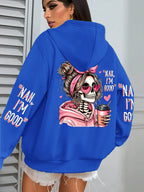 Blue hoodie with a skeleton design and text on the back, worn by a person.