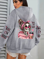 Gray hoodie with a skeleton design and text on the back, worn by a person.