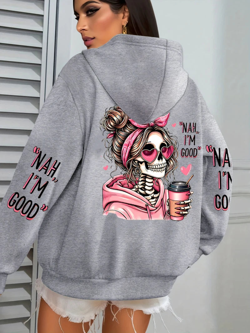Gray hoodie with a skeleton design and text on the back, worn by a person.