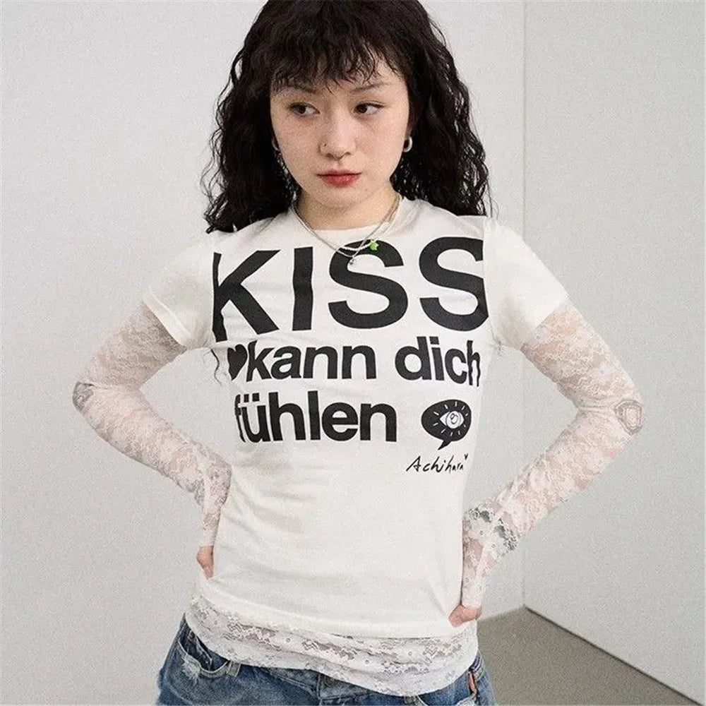 Person wearing a white Kiss T-shirt Fashion Vintage Harajuku Streetwear and lace sleeves against a plain background.