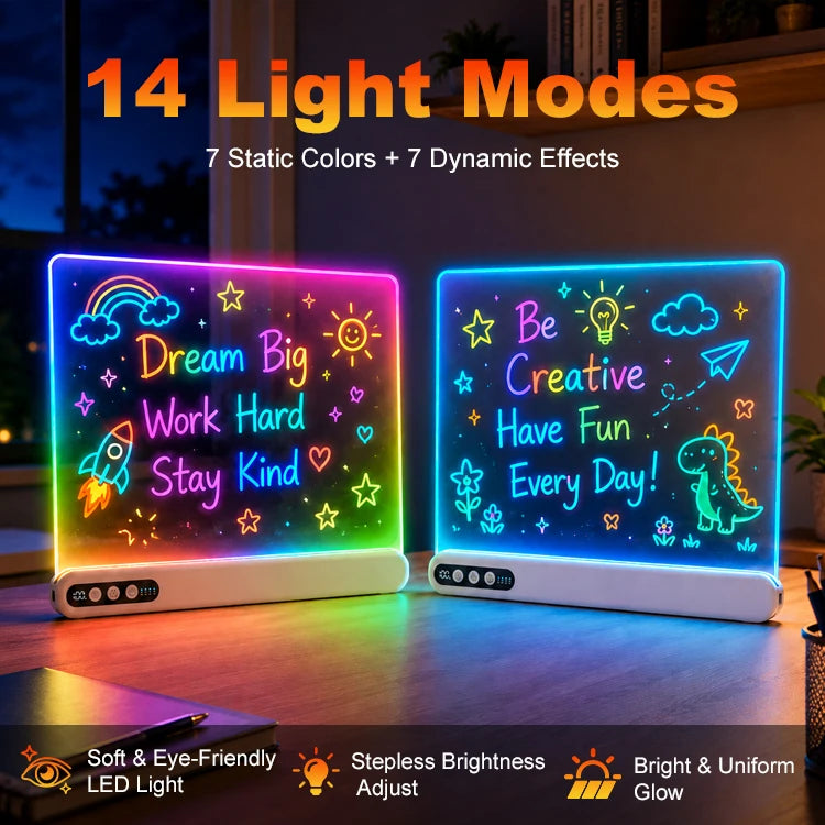 Two glowing LED light-up message boards on a wooden table at night, with colorful neon-style drawings and text including 'Dream Big Work Hard Stay Kind' and 'Be Creative Have Fun Every Day!'. Large text at the top reads '14 Light Modes' and feature callouts appear along the bottom.