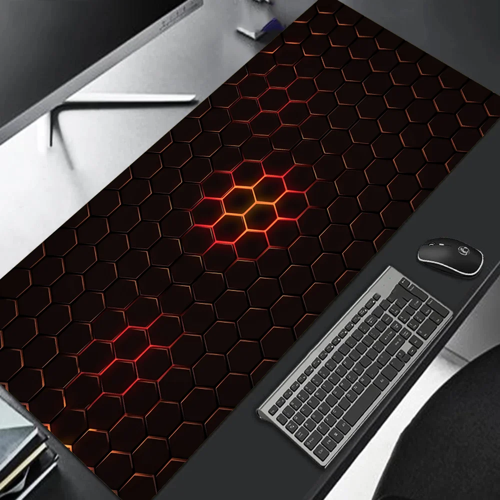 Large desk mat with hexagonal pattern on a desk with keyboard and mouse.