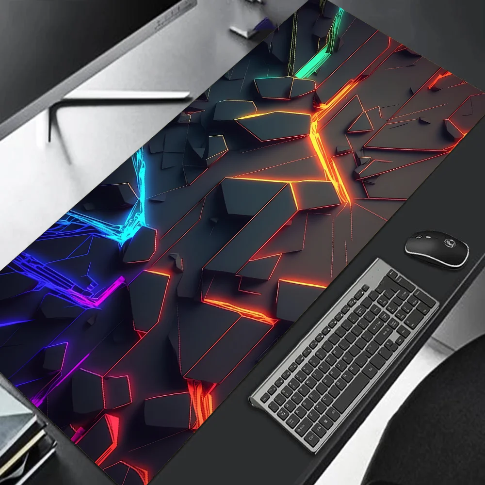 Colorful desk mat with geometric design on a desk with keyboard and mouse.