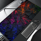 Colorful geometric desk mat on a desk with a keyboard and mouse.