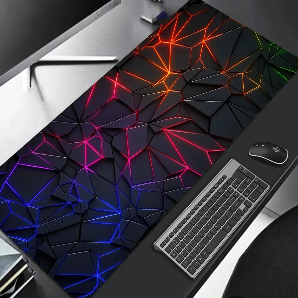 Colorful geometric desk mat on a desk with a keyboard and mouse.