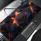 Gaming desk setup with a large mouse pad featuring geometric design and lighting effects.