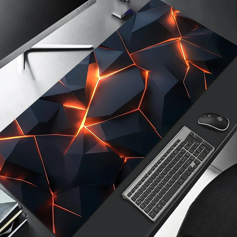 Gaming desk setup with a large mouse pad featuring geometric design and lighting effects.