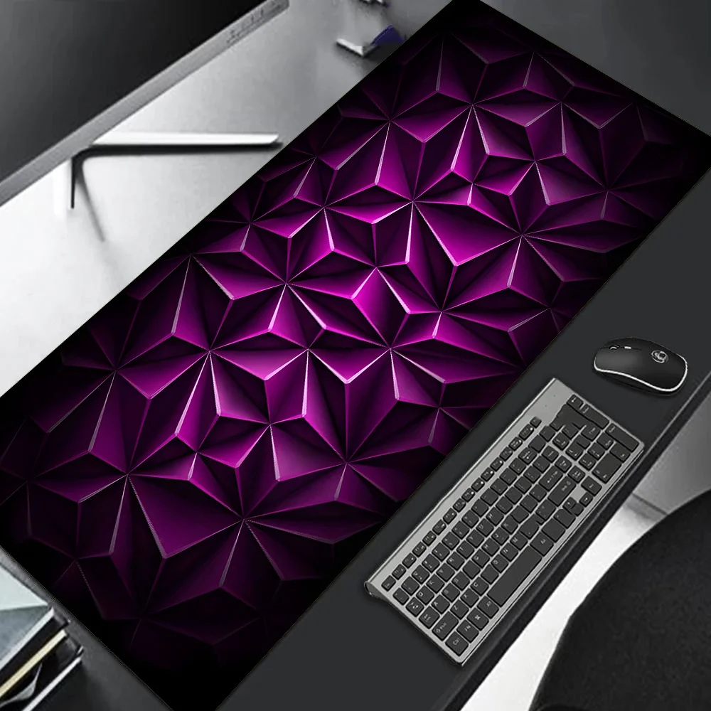 Desk setup with a large purple geometric patterned mouse pad, keyboard, and mouse.