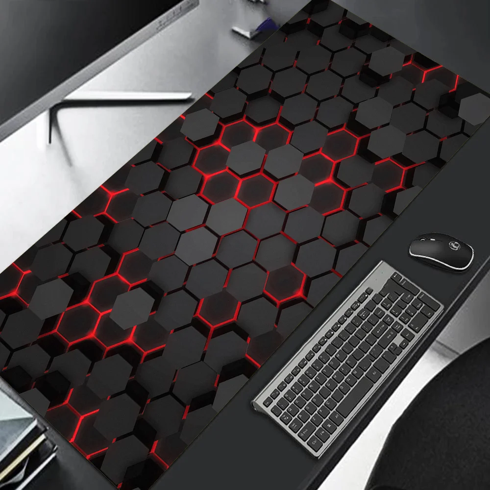 Black and red hexagonal patterned desk mat with a keyboard and mouse on a desk.