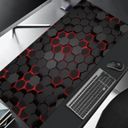 Black and red hexagonal patterned desk mat with a keyboard and mouse on a desk.