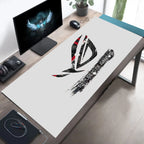 A large white desk mat featuring a black and red Republic of Gamers logo, laid out on a wooden desk in a modern home office setup.
