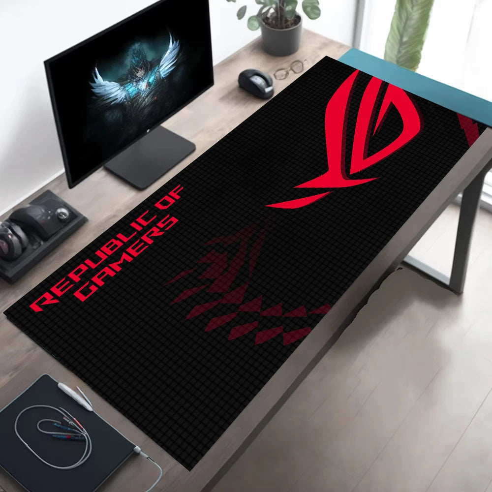 Gaming desk setup with a Republic of Gamers mouse pad.
