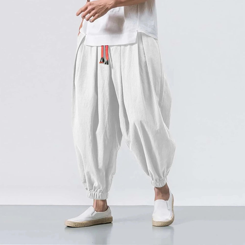White pants with a red and black stripe on a white background
