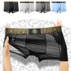 Black men's boxer briefs with a gold patterned waistband and a central gold monogram logo, held up by hands. The main product is shown in the center, with four smaller color variants (black, white, gray, and light blue) displayed at the top against a white background with a gray ornamental pattern.