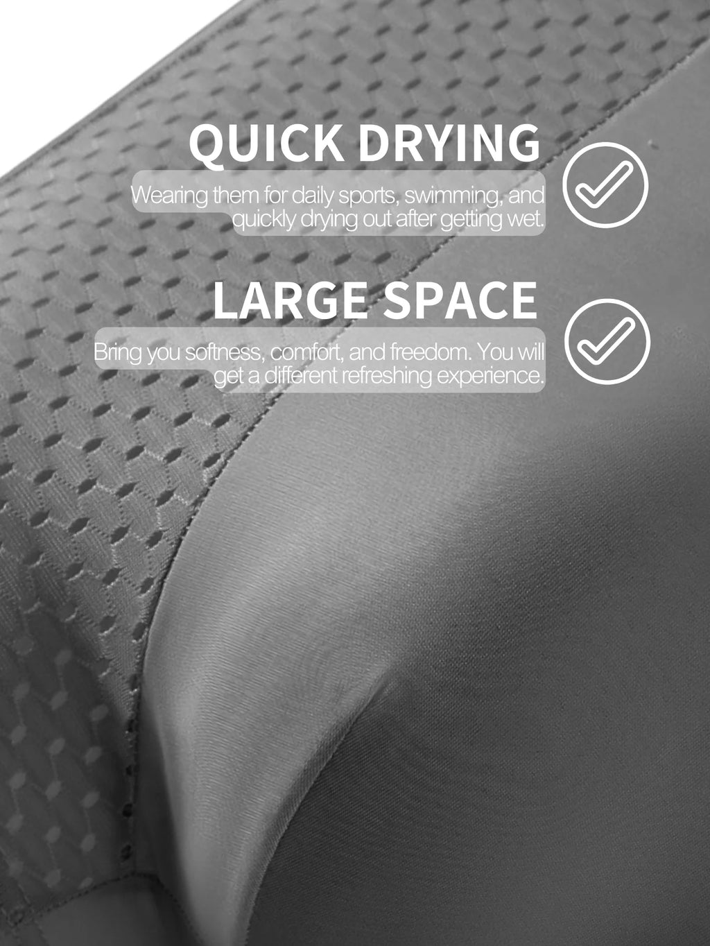 Close-up of a dark gray athletic swim cap with a textured patterned side and smooth curved front, featuring white text overlays that read 'QUICK DRYING' and 'LARGE SPACE' with check marks.