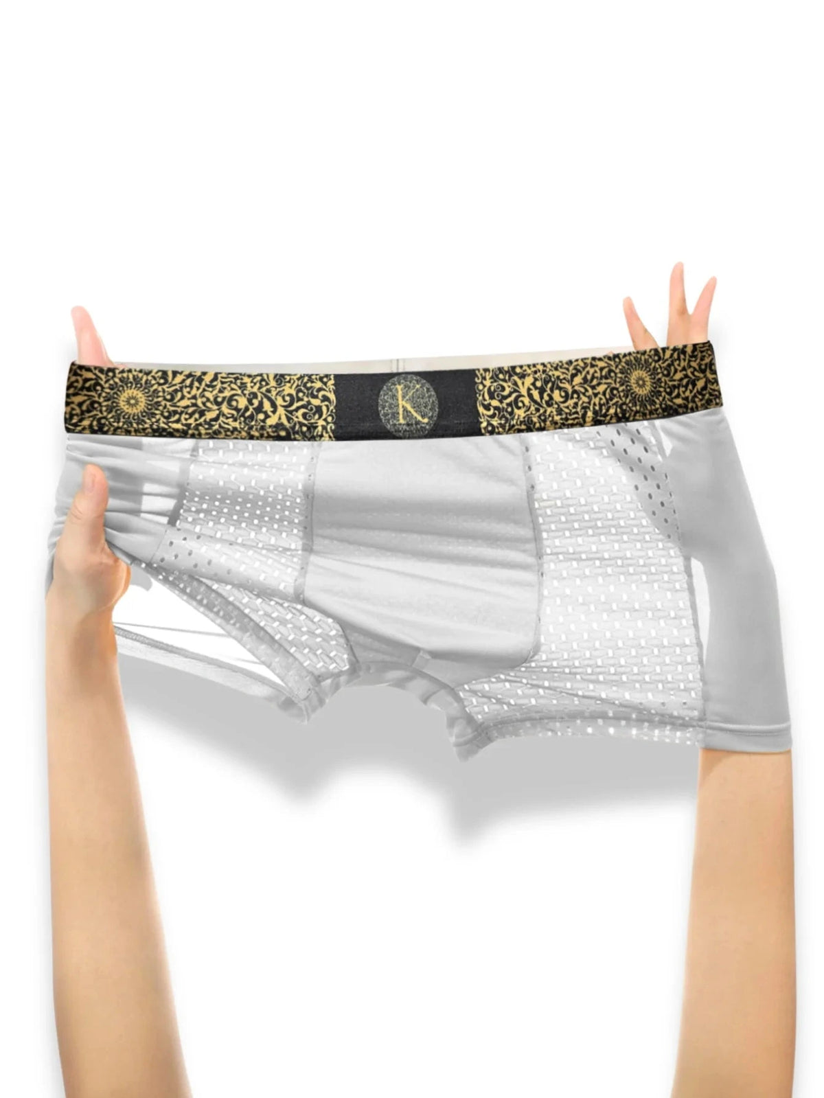 White boxer briefs with a decorative black waistband held by hands on a white background