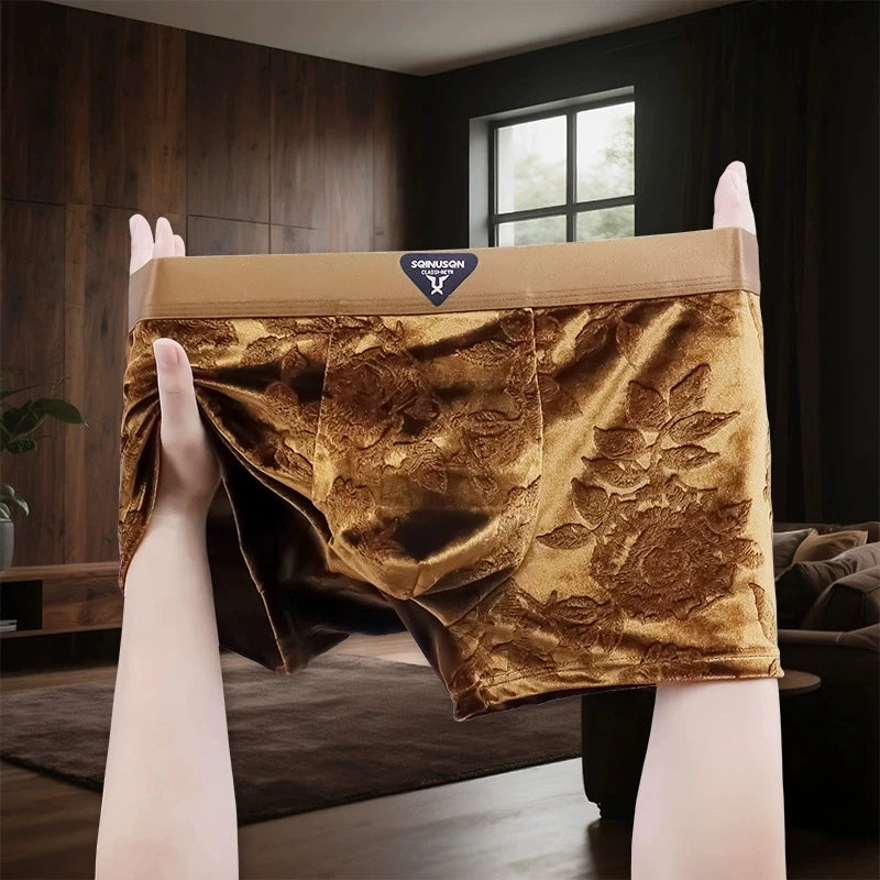 A pair of men's briefs with a luxurious gold brocade floral pattern and a beige waistband.