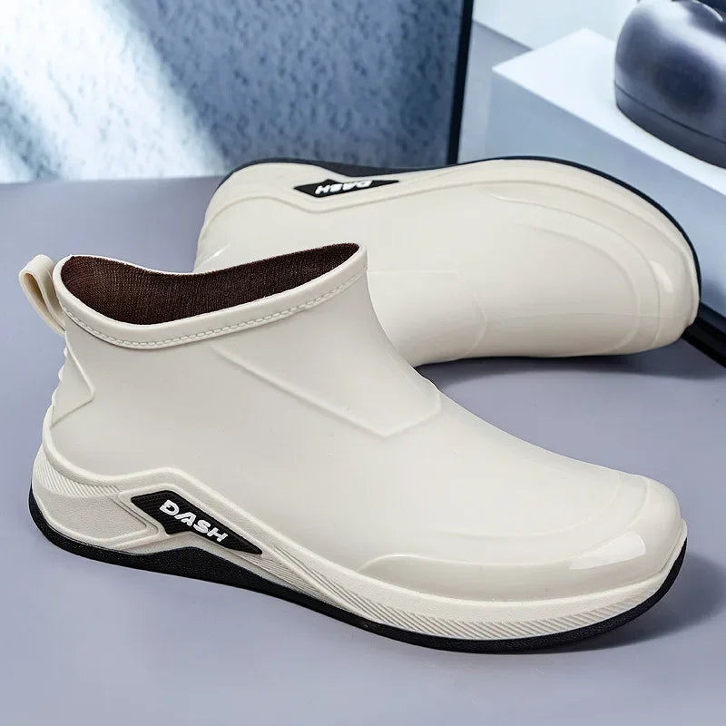 White slip-on shoes with black sole on a gray surface