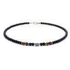 Necklace with black and brown beads on a white background