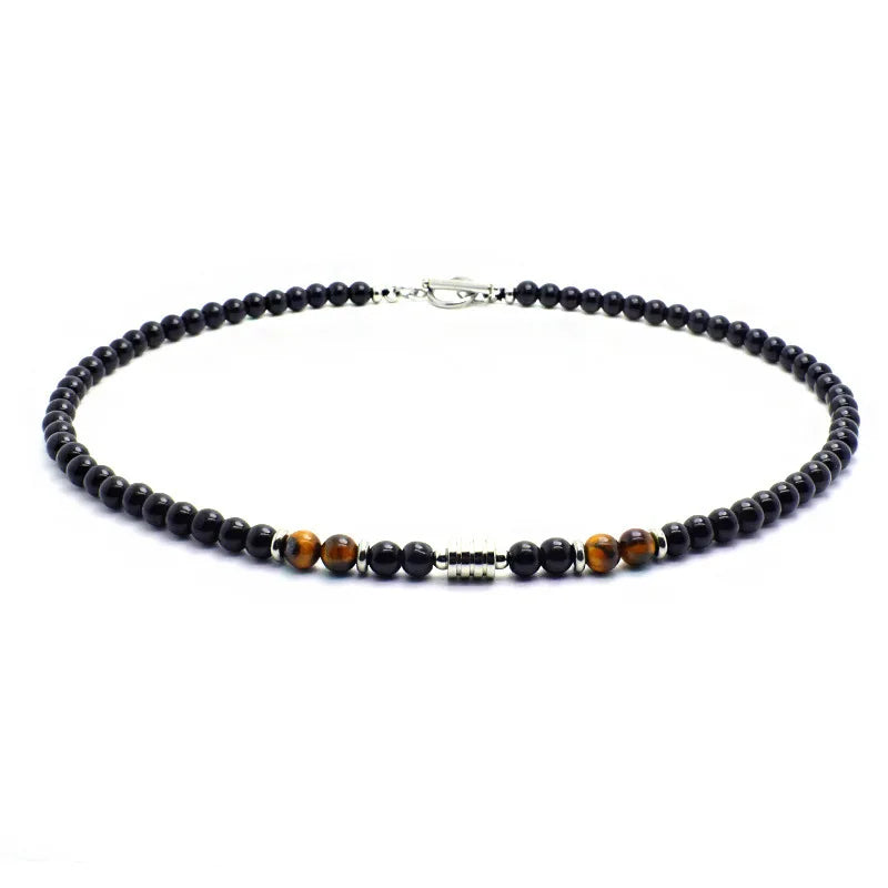 Necklace with black and brown beads on a white background