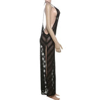 Black sheer dress on a mannequin against a white background