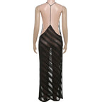 Black sheer dress on a mannequin against a white background
