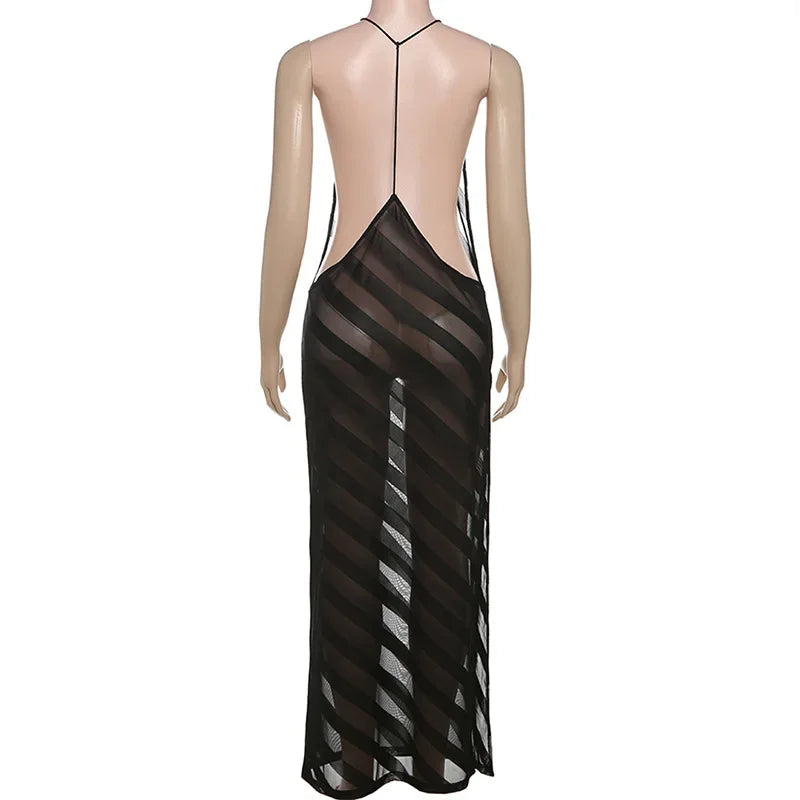 Black sheer dress on a mannequin against a white background