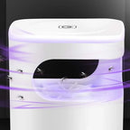 White mosquito home trap device with purple light emitting towards mosquitoes.